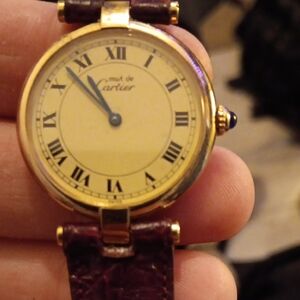 Authentic Cartier Gold Timepiece with Deep Red Strap